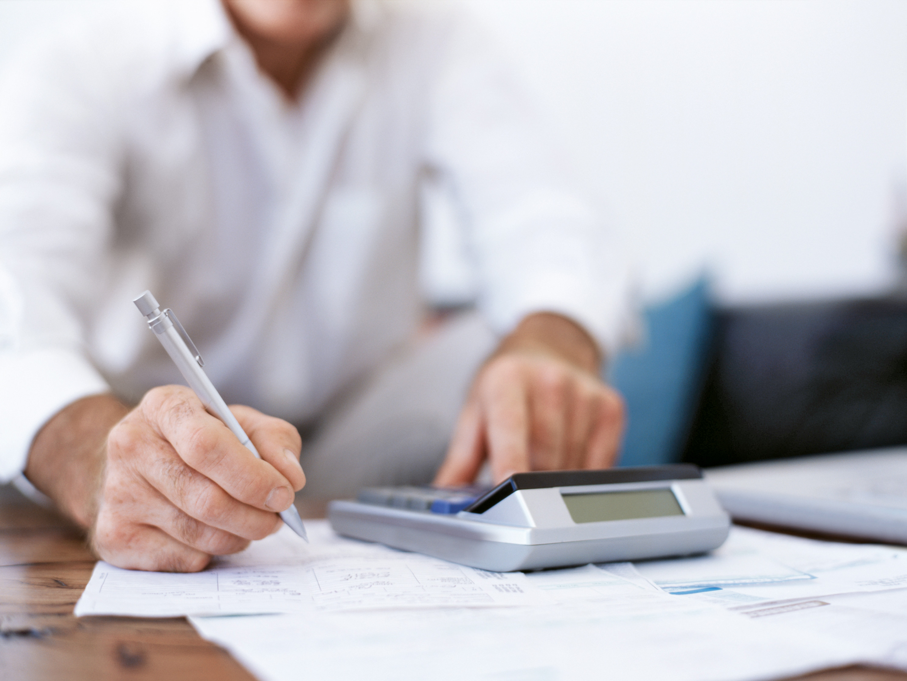 Man with calculator for calculation